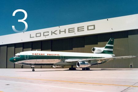 A shiny Lockheed L-1011 Tristar in front of the Lockheed factory in the US in Cathay Pacific livery