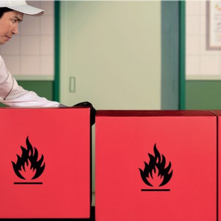 Cathay staff lifting dangerous goods parcel carefully