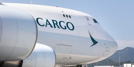 A close-up of the nose of a Cathay cargo plane
