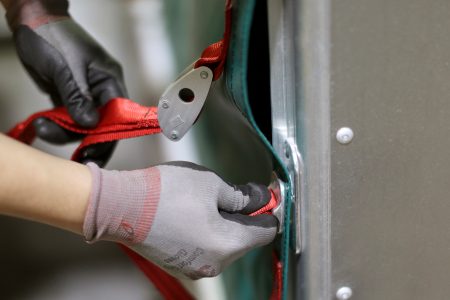 A person securing an objective with a safety belt