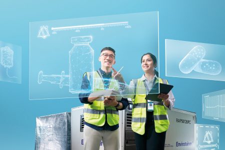 Cathay Cargo personnel looking at screens showing different medical devices