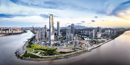 The Zhuhai skyline surrounded by water with clouds rolling overhead