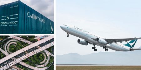 A large green Cathay Cargo truck parked on grass on a sunny day