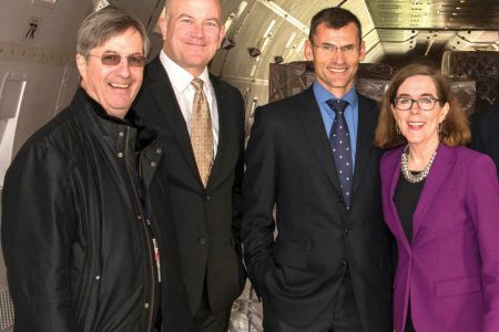 Bill Wyatt, Curtis Robinhold, Philippe LaCamp, Governor Kate Brown inside cargo aircraft
