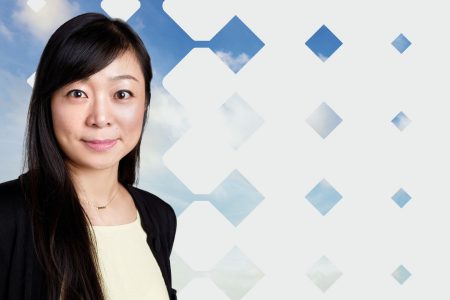 Joanna Zhu photo with blue sky and diamond pattern background