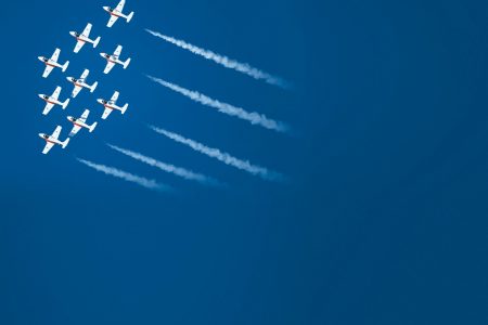 Small aircraft flying in formation
