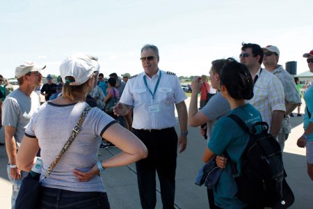 Captain Mark Hoey speaking to guests on runway