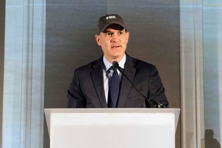 Simon Large at podium