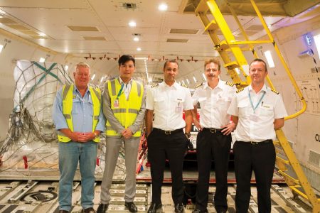 Pilots Brendan Brady, Gus Laard and Brad Jaques inside cargo aircraft
