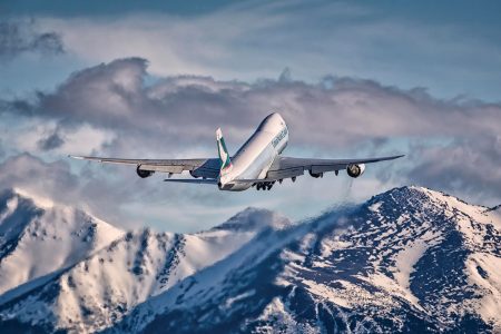 Cathay aircraft flying over snow covered mountains