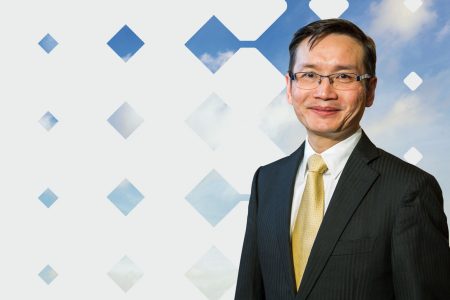 Tony Sham photo with blue sky and diamond shape pattern background
