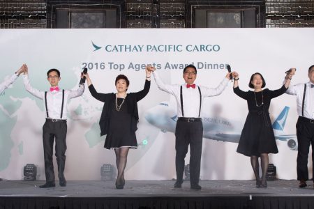 Aaron Chan with team, performing on stage