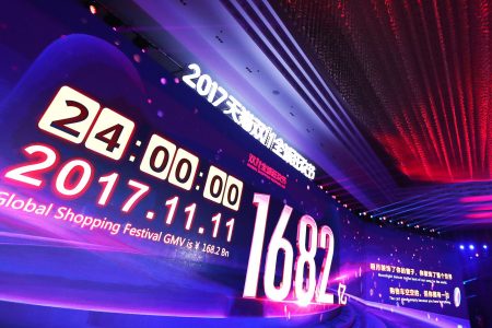 single's day sales revenue of 168.2 billion RMG displayed on screen at event