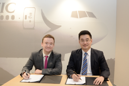 Will Staddon and Frosti Lau signing papers