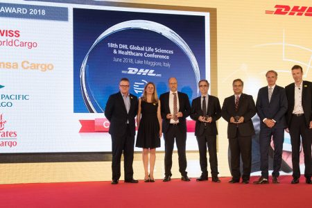 Award winner and award presenter standing together.