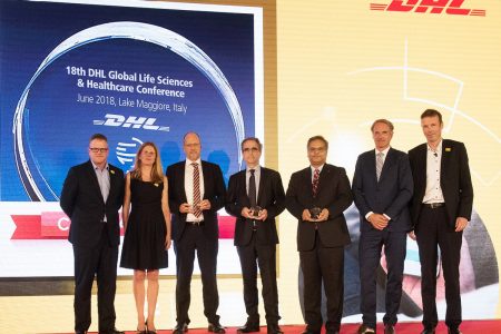 Cathay's Ray Jewell with DHL executives onstage at DHL event
