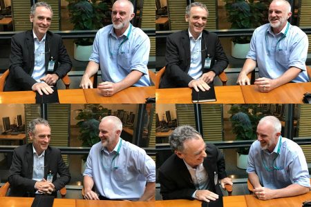 Ray Jewell and Jansen Stafford candid photos at desk