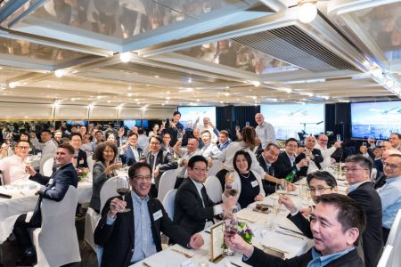 group photo of all guests at a party, seated at tables