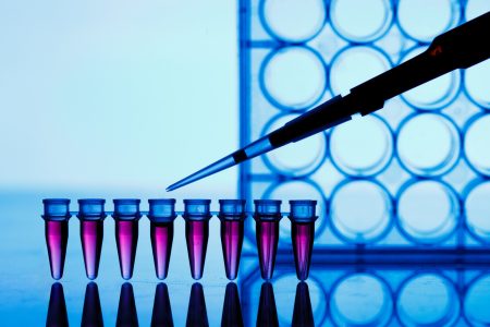 Dropper and vials with translucent purple liquid