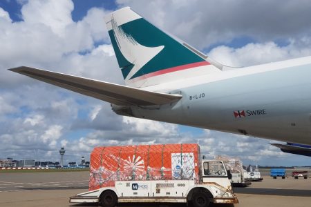 Cargo container on vehicle to transport on plane