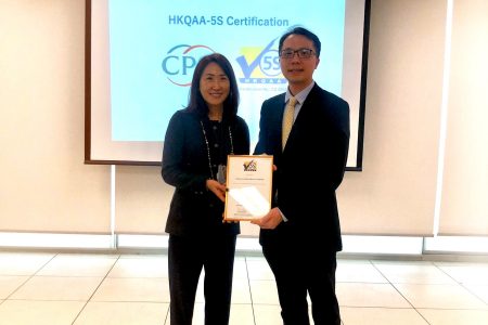 Two people holding 5-S certificate