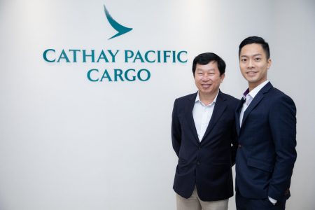 Son Duong and Jason Choi with Cathay Cargo office sign