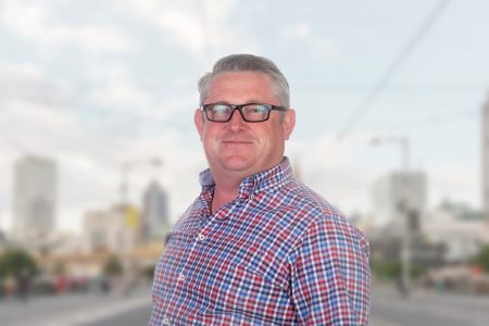 Colin Dunne standing outdoors