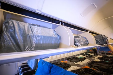 Hongkong post shipments in overhead bins in passenger cabins