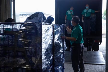 Hongkong Post staff handling shipments