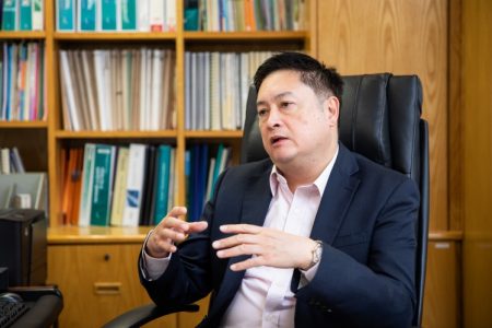 Patrick Lin in office chair