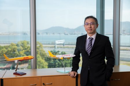 Clarence Tai with AHK and DHL aircraft models