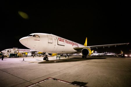 Air Hong Kong aircraft on tarmac at night