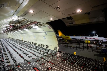 Interior of Air Hong Kong aircraft fuselage with another plane visible through open door