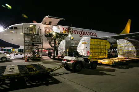 Air Hong Kong aircraft at night being loaded with cargo