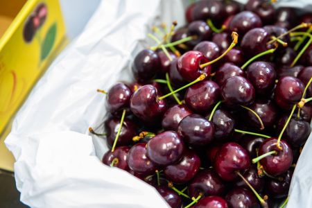 Box of cherries with lid open