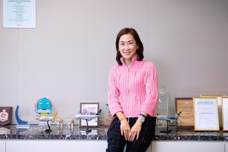 Jenny Lam with model aircraft and certificates 