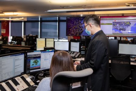 Dennis Lam looking at monitor