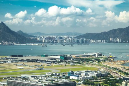 Panoramic view of Hong Kong airport, ships city and skyline in distance