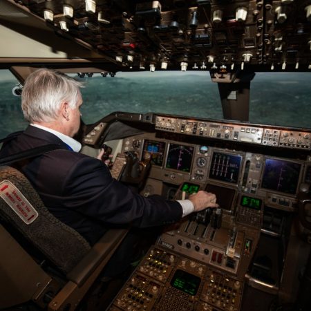 Pilot in flight sim cockpit