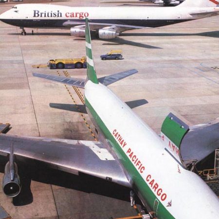 film photograph of 747 in British Airways cargo livery behind Cathay 707