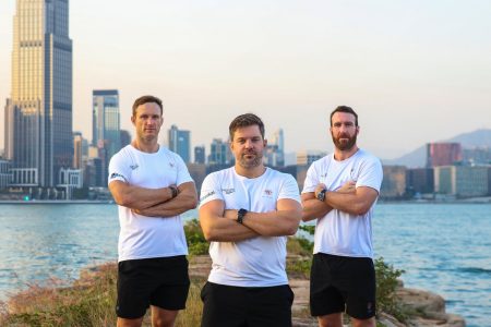 Martin Muller, Matt Bell and Robert Lennox posing with water and skyline behind
