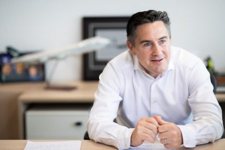 Tom Owen at desk in office