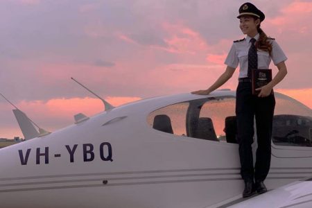 Cherie Cheng standing on aircraft