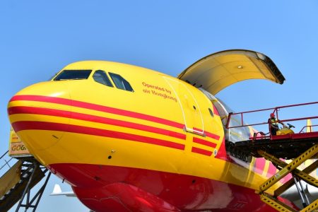 scissor lift connected to DHL/air Hong Kong aircraft