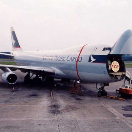 Cathay aircraft with cargo nose door open and MXP commemorative sign in 2002