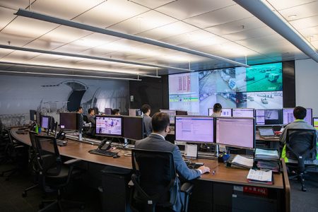 Staff at workstations in operations control center