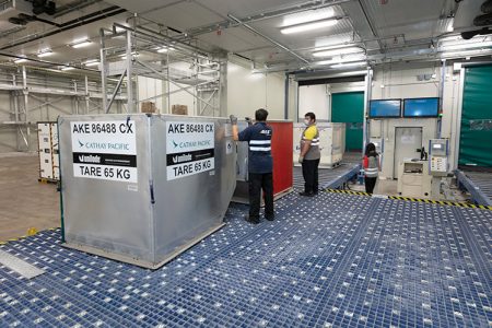 Staff and ULD in cargo terminal