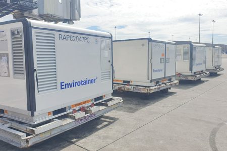 A row of cooltainers on the tarmac