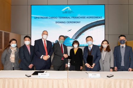 Cathay's Mark Watts and Tom Owen with Airport Authority management at signing ceremony