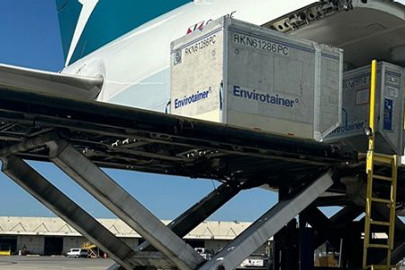 A cooltainer being loaded onto a Cathay aircraft